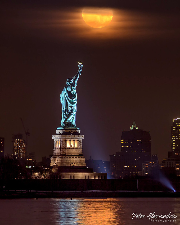 Snow Moon over Statue of Liberty